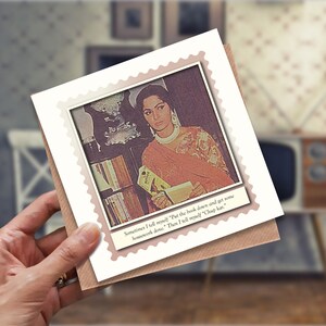May include: A card with a photo of a woman in a pink sari holding a book. The text on the card reads "Sometimes I tell myself 'Put the book down and get some housework done.' Then I tell myself 'Chup kar.'"