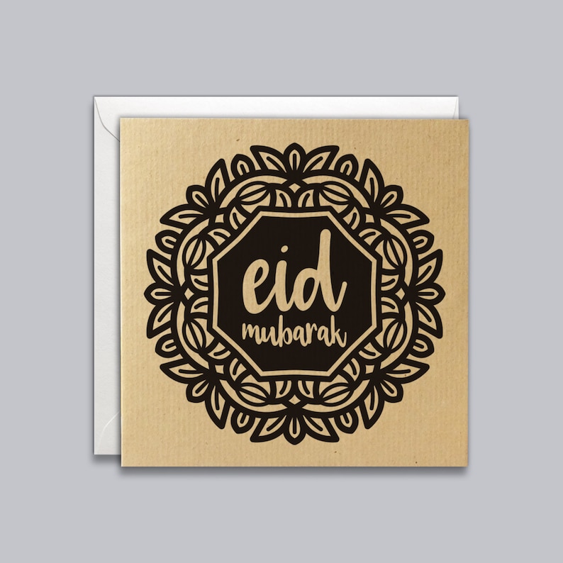 May include: A brown card with a black mandala design and the text "eid mubarak" in gold lettering.