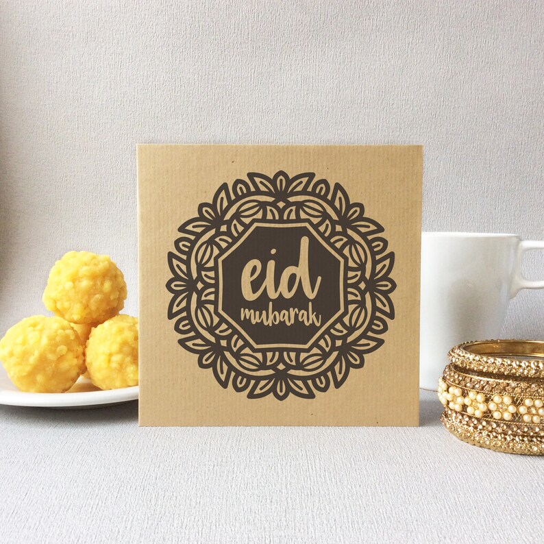 May include: A brown card with a black and white mandala design and the text "eid mubarak".