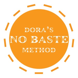 May include: Orange circle with a white dashed border and the text "DORA'S NO BAKE METHOD" in white.