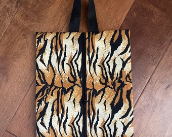 Shoe tote bag in cotton tiger stripes and lined in black cotton, 9 x 15 12" with 2" gussets on the side.