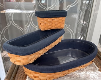 Group of 3 Vintage Tasket baskets with blue cotton lining and plastic insert liner.