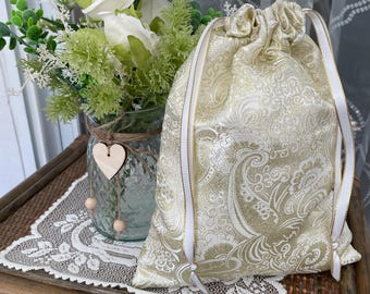 Gold thread on ivory satin paisley gift bags with drawstrings