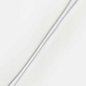 May include: A white elastic cord with two loops at each end.