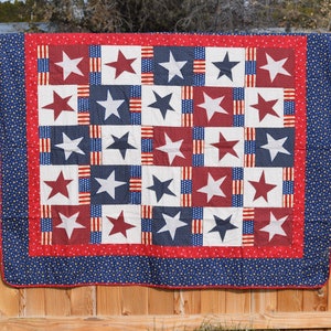 Beautiful patriotic quilt in stars and stripes red, white and blue 60 X 72 inches