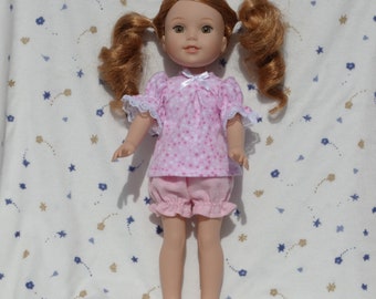 Cute pink flannel pajamas in a star print trimmed with a white bow, fits 14.5 inch dolls.  This doll has a 6 inch waist