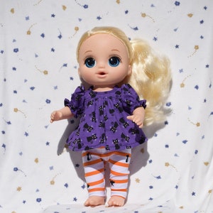 Cute purple dress in a black cat print with orange and white striped leggings with black cats, fits 13 inch baby dolls