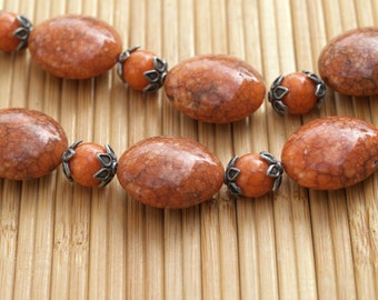 Chunky Orange or Rust Acrylic Beads with Metal Flower Caps