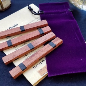 Geomancia - Bastones de druida - Madera de sangre con incrustaciones de ébano