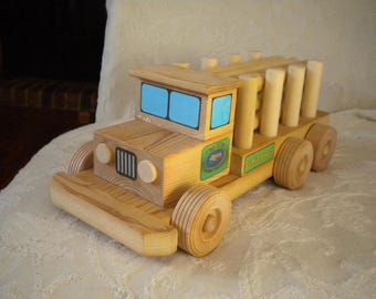 Personalized Wooden Toy Log Truck. Logos are personalized with recipient choice of Name and company name and date of company establishment.