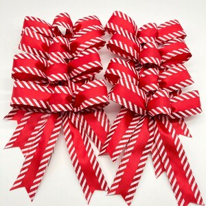 Christmas peppermint Tree Bows - Set 8 Bows - Red and White Christmas Bows 
Measurements
6 inches wide
6 inches long tails
1.5 inches wide
 ( wired ribbon )