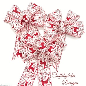 Red Burgundy Reindeer Christmas Decorative Bows - Set 3 Bows

Measurements
10 inches wide
10 inches long tails
2.5 inches wide ( wired ribbon )