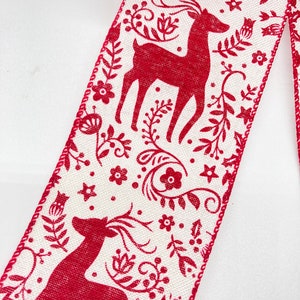 May include: Red and white ribbon with a repeating pattern of reindeer and floral designs. The ribbon has a white background with red reindeer and floral designs.