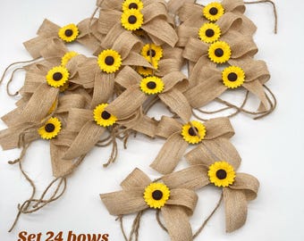 May include: Set of 24 burlap bows with yellow sunflower accents. Each bow has a twine loop for hanging or attaching.