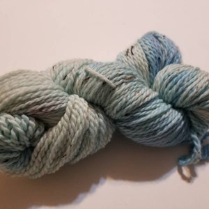 Sky Tweed, a hand-dyed merino wool, baby alpaca, viscose aran weight yarn. 180yds/100gms. 4-4.5sts=1&quot; on #7-9 needles.