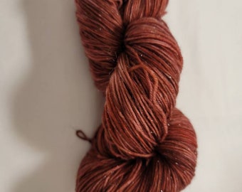 Chocolate Ice Cream Shimmer, a hand-dyed superwash merino wool/nylon/stellina blend fingering weight yarn.  463yds/100gms. 7-8sts=1" on #1-3