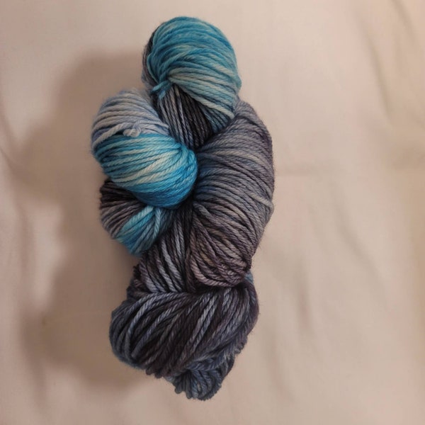 Neptune, a hand-dyed superwash merino wool worsted weight yarn.  220yds/100gms.  4.5-5sts=1" on #6-9 needles.