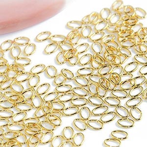 Anelli ovali placcati oro 18k 6x4 mm x 50