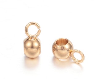 May include: Two gold-toned metal bead caps with a loop on one end. The bead caps are round and have a smooth finish.