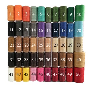May include: A collection of 50 spools of waxed thread in a variety of colors, numbered 1 through 50. The colors range from orange, red, and green to black, brown, and white. Ideal for crafting and jewelry making.