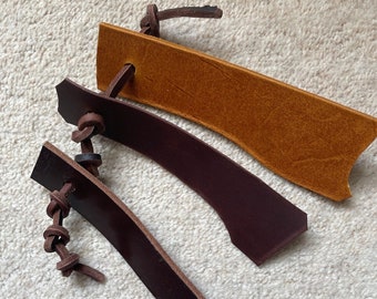 Leather scraps knotted on a thong; great chew toy for teething dogs / puppies