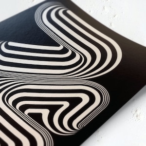 May include: Abstract black and white print with a geometric pattern of curved lines creating a 3D effect.