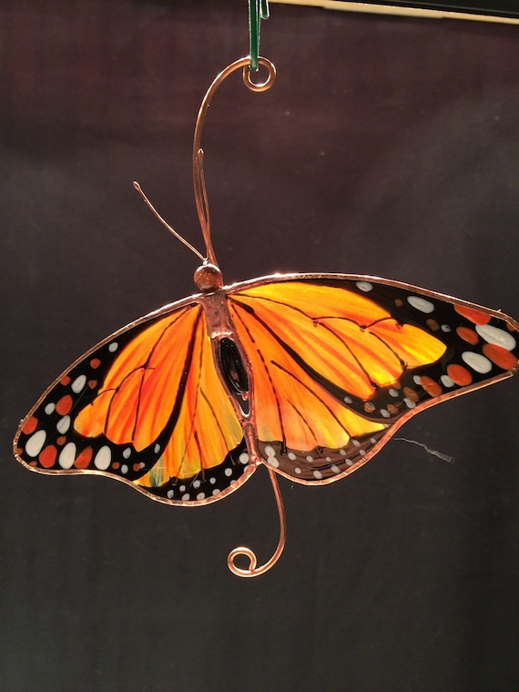 Relaxed Monarch Butterfly stained glass suncatcher.