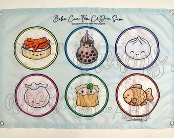 May include: A light blue banner featuring a Vietnamese Lunar New Years game. The banner has six circular illustrations of food items, including boba tea and dim sum. The text "Boba Cua Tôm Cá Dim Sum" is at the top.