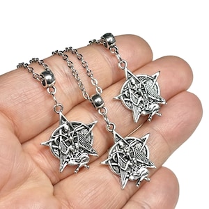 May include: Three silver necklaces with a pentagram pendant featuring a winged demon figure. Each pendant is detailed with intricate carvings and a five-pointed star.