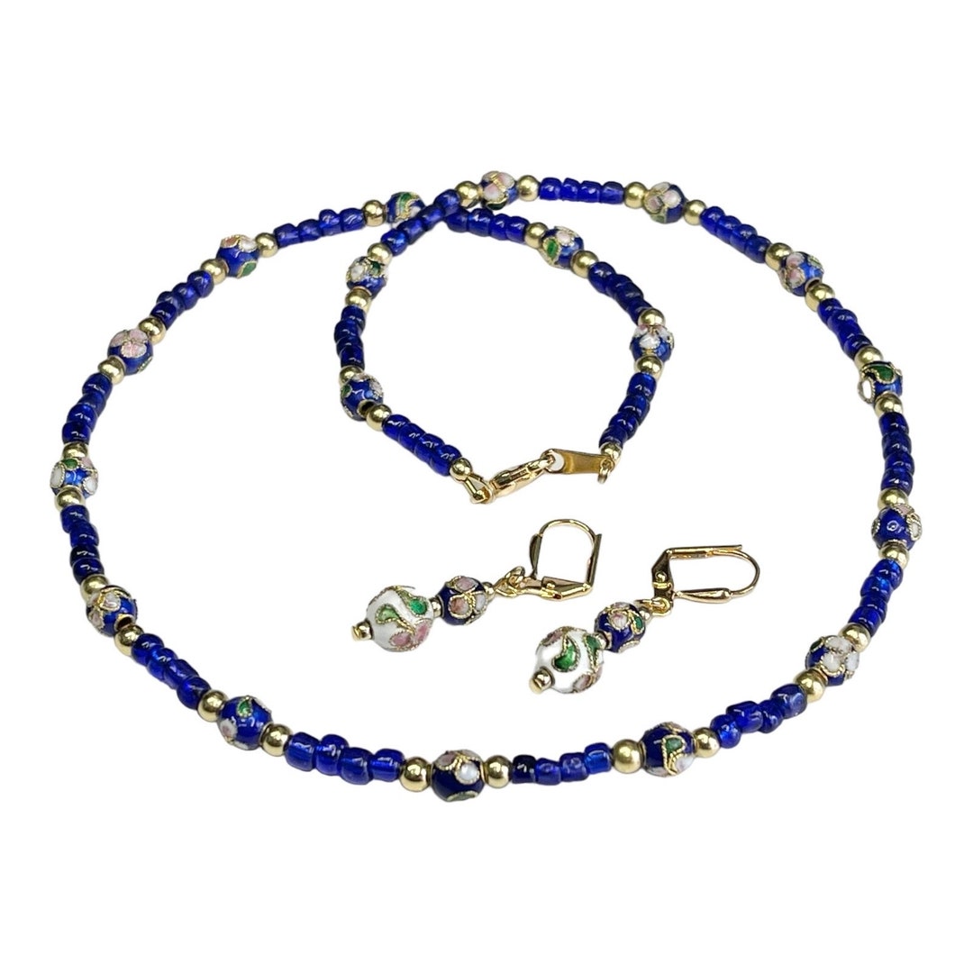 Blue Crystal Necklace Earring Set In Blue Crystal In Gold