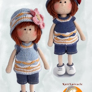 May include: Two crocheted dolls wearing blue and white striped dresses and hats with flowers. The dolls have red hair and are standing on a white background. The image includes the text "KnitAmiracle".
