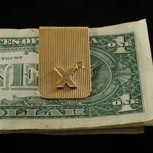 Sujeta billetes vintage con forma de letra X, de acero chapado en oro, con textura acanalada, dañado, con chip de diamante faltante, nuevo, stock antiguo, bricolaje
