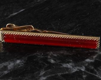 Vieux vintage Tie Clip Red Plastic Top Laiton plaqué or utilisé dans les années 1950