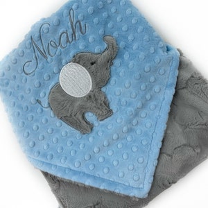 May include: A set of three ceramic mugs with a speckled, matte finish. The mugs are in cream, light grey, and dark grey. Each mug has a simple, minimalist design, ideal for coffee or tea.