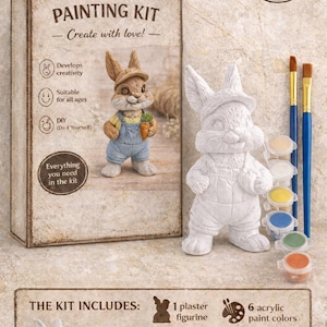 May include: A painting kit featuring a plaster bunny figurine, acrylic paints, and brushes. The kit includes a box with the words "PAINTING KIT" and "Create with love!" The kit is suitable for all ages and develops creativity.