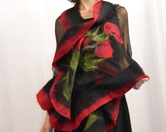 May include: A black and red silk scarf with a floral design. The scarf is draped around a person's neck and shoulders.