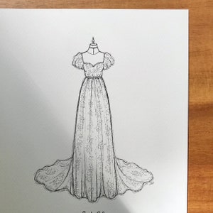 May include: A black and white line drawing of a wedding dress with a sweetheart neckline, short puff sleeves, and a full skirt.