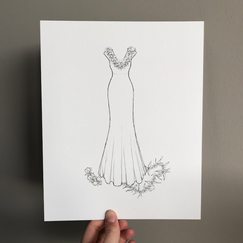 May include: A line drawing of a wedding dress with a floral neckline and a flowing skirt. The dress is surrounded by floral embellishments.