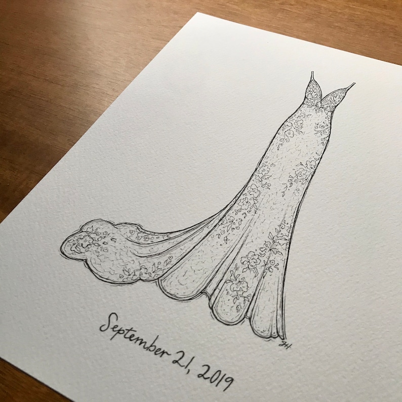 May include: A black and white line drawing of a wedding dress with a fitted bodice and a flowing skirt. The dress is decorated with intricate floral details. The date "September 21, 2019" is written below the dress.