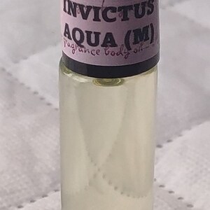 Fragrance Roll-On Body Oils 1/3oz bottle. Our impression of all our fragrances. Invictus Aqua (M)