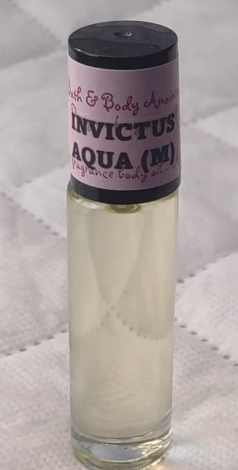 Fragrance Roll-On Body Oils 1/3oz bottle. Our impression of all our fragrances. Invictus Aqua (M)