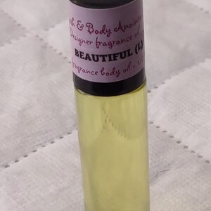 Fragrance Roll-On Body Oils 1/3oz bottle. Our impression of all our fragrances. Beautiful (L)