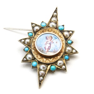 May include: A gold-toned starburst brooch featuring a central miniature painting of a cherub. The brooch is adorned with pearls and turquoise stones. The pin is a vintage piece of jewelry.