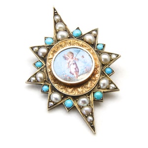 May include: A gold-toned starburst brooch featuring a central oval miniature painting of a cherub with a bow and arrow. The brooch is adorned with pearls and turquoise stones, creating a detailed and elegant design. The brooch is a vintage piece.