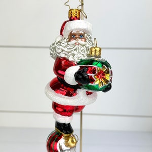 Christopher Radko Santa Balancing on Ornaments Glass Christmas Ornament CR image 1