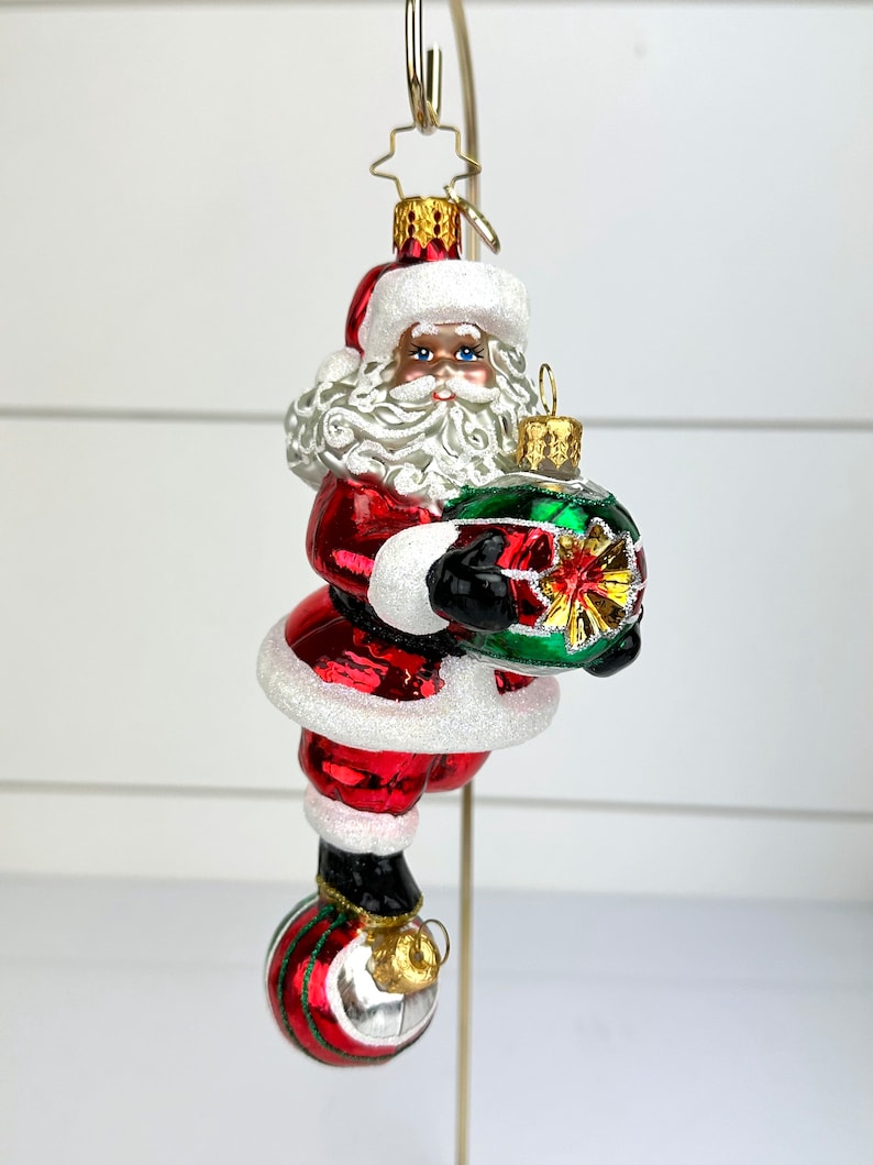 Christopher Radko Santa Balancing on Ornaments Glass Christmas Ornament CR image 1