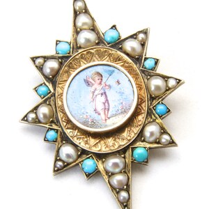 May include: A gold-toned starburst brooch featuring a central miniature painting of a cherub with a bow and arrow. The brooch is adorned with pearls and turquoise stones, creating a vintage aesthetic.