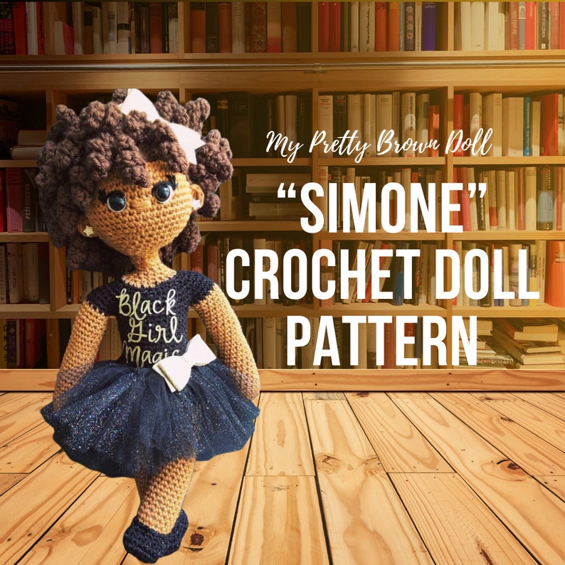 May include: Crochet doll pattern for a brown-skinned doll named "Simone". The doll is wearing a black dress with a gold "Black Girl Magic" inscription, a black tulle skirt with glitter, and a white bow. The doll has brown curly hair and brown eyes.