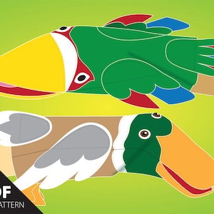 May include: A printable PDF file pattern for making two finger puppets, one green duck and one brown duck with white wings. The ducks have yellow beaks and red mouths.