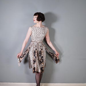 60s 1960s BLANES cream black and bronze gold patterned COCKTAIL dress with fringe panel skirt design and matching belt - XS / petite fit
